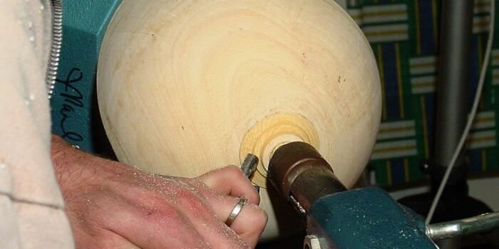 Removing the tenon to form round bottom